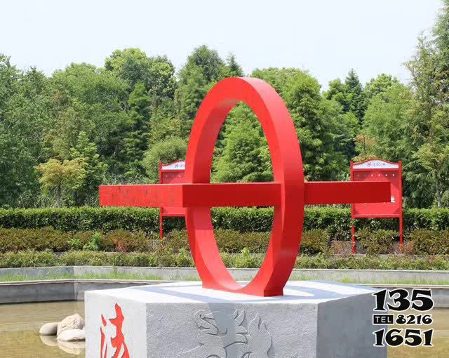 法治雕塑-公園草坪創意大理石上的不銹鋼法治雕塑高清圖片