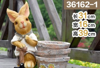 兔子雕塑-動物園擺放一只休息的玻璃鋼兔子雕塑